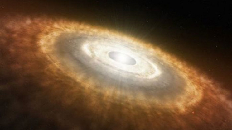  Καλλιτεχνική απεικόνιση του άστρου TW Υδρα και του δίσκου ύλης που έχει σχηματιστεί γύρω από αυτό. Οι επιστήμονες ανακάλυψαν ότι σχηματίζεται εκεί ένας πλανήτης παρόμοιος με την Γη